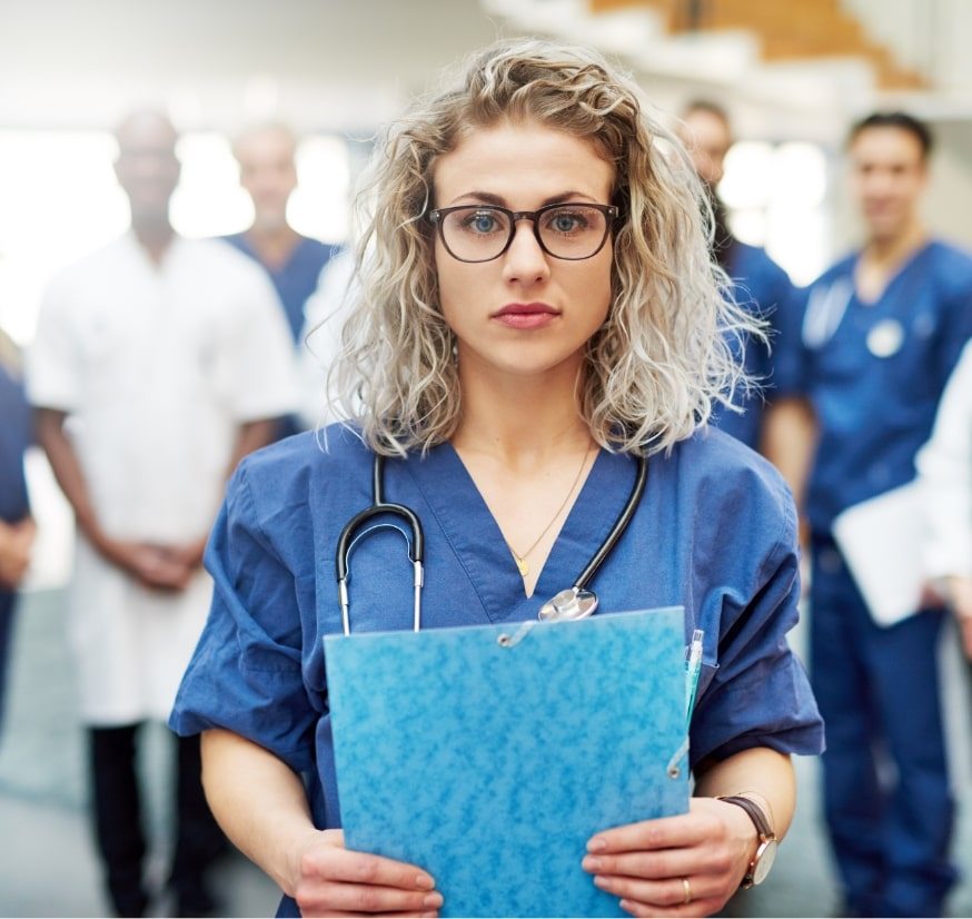 young-medicine-worker-standing-in-hospital-2CLPHUV